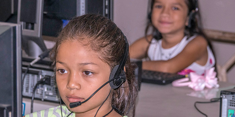 Young girl with a computer head set