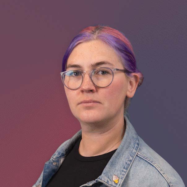 Lily-panella White woman with multi-colored hair and glasses